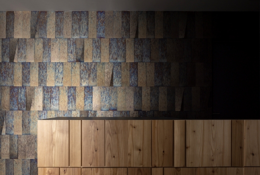 Decoration of hotel reception walls using SUS304 stainless steel, known for achieving the distinct 'Oboro' coloration, resulting in a characteristic blue finish.